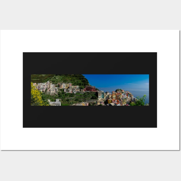 View on the cliff town of Manarola, one of the colorful Cinque Terre on the Italian west coast Wall Art by Dolfilms